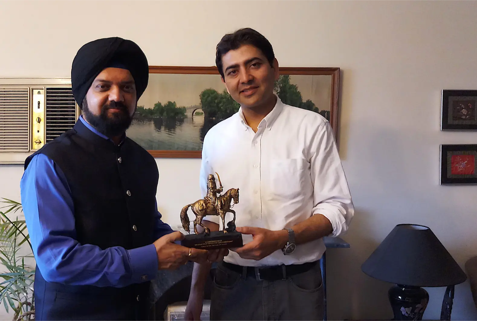 Bobby Singh Bansal Sikh historian, author and film maker presenting an Emperor Ranjit Singh momento to Ali Jan