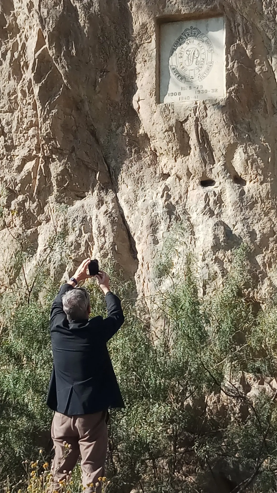 Corps of Guides insignia carved on a cliff face in Khyber Pass